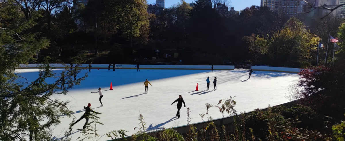 Skaters on the ice at Wollman Rink in New York City's Central Park